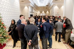 Crowd of people networking at WinDoor event